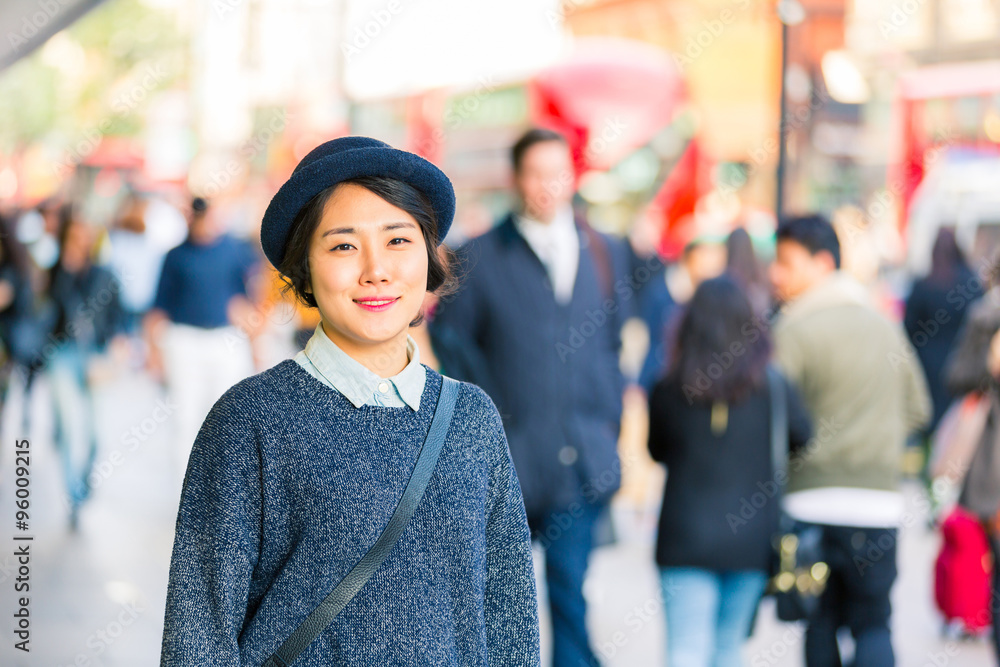 Portrait of an asian woman with blurred people on background Portrait of an asian woman with blurred people on background