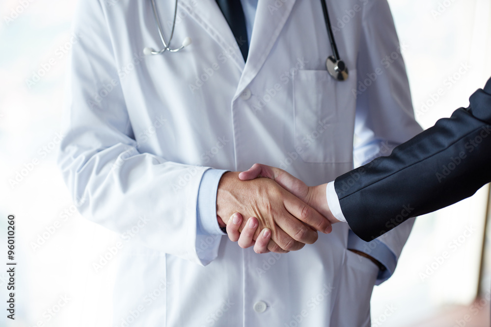 doctor handshake with a patient doctor handshake with a patient