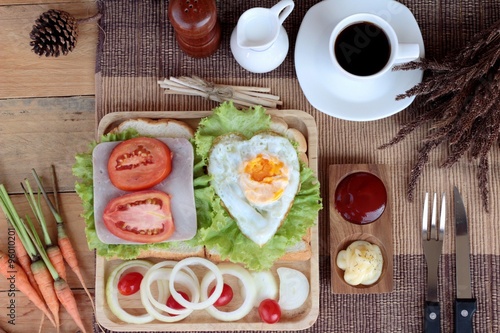 Slice bread ,ham ,fried eggs with breakfast.
