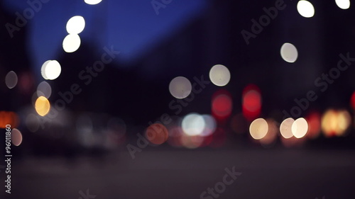 city lights and traffic in out of focus context blurred and bokeh, evening in big busy city photo