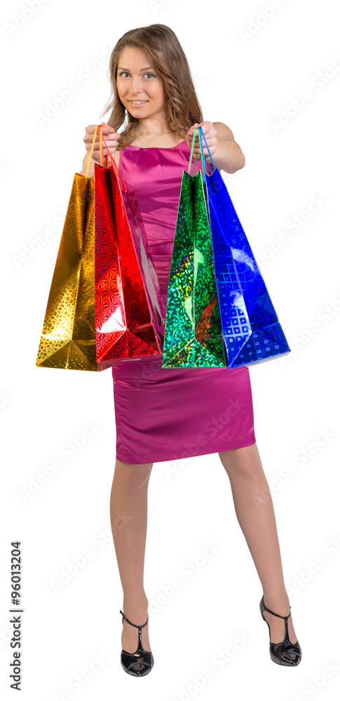 Shopping woman holding bags, isolated on white studio background Shopping woman holding bags, isolated on white studio background