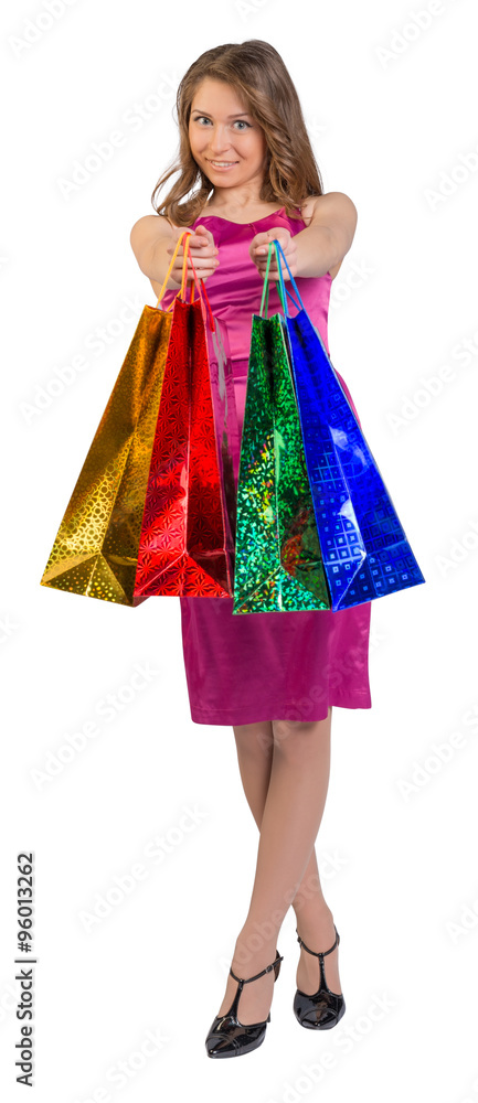 Shopping woman holding bags, isolated on white studio background