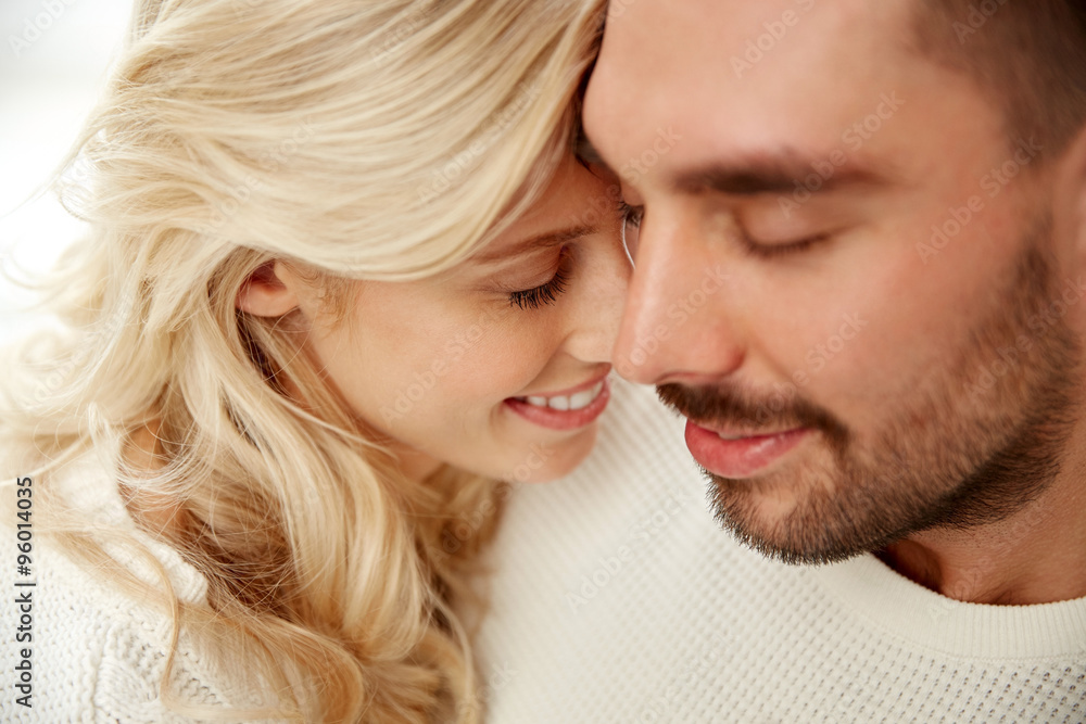 close up of happy couple faces with closed eyes