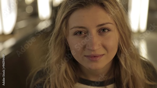 Wallpaper Mural Beautiful girl smiling at the camera with a dynamic light. The descent into the subway escalator Torontodigital.ca