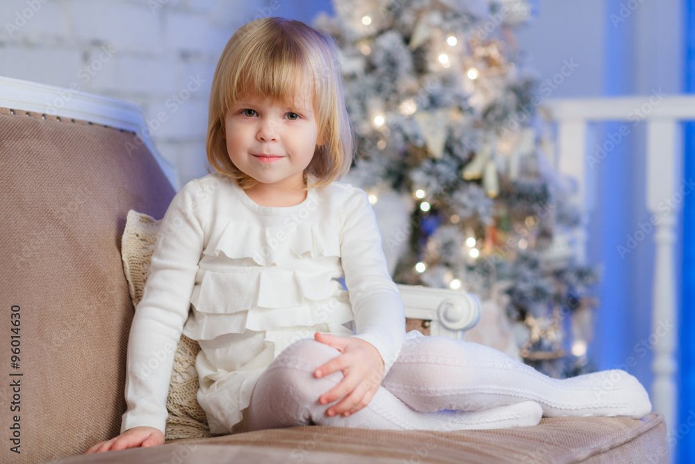 Happy girl near Christmas tree. Happy girl near Christmas tree.