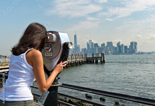 Woman Looking Through View Finder at NYC Skyline