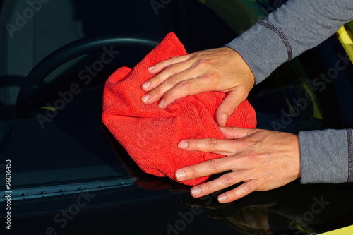 Car with wax and polish cloth. © grinny