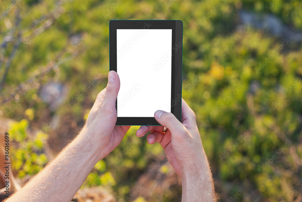 Men's hands hold an eBook