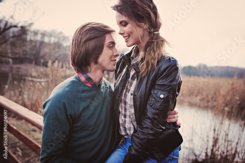 happy young loving couple on cozy country walk