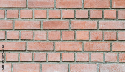 Closeup old red stone brick wall texture background