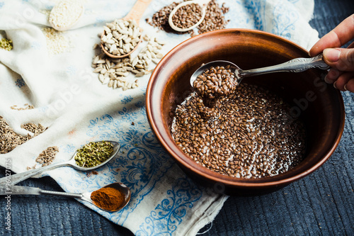 cooking process of handmade crackers from flax, sesame, sunflowe photo