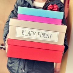 man with boxes with the text happy black friday