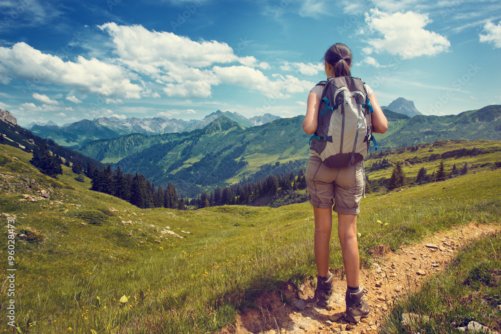 Female Hiker Admiring View of Mountain Valley