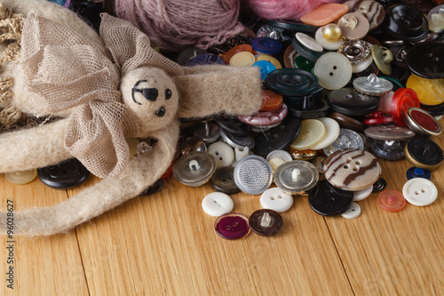 Heap of button on wood table