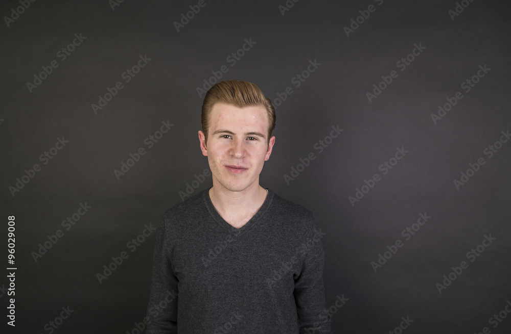 portrait of cute teenage boy with red hair