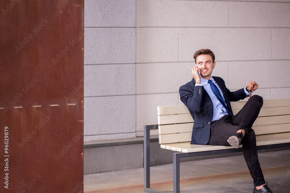 Businessman waiting for a train Businessman waiting for a train