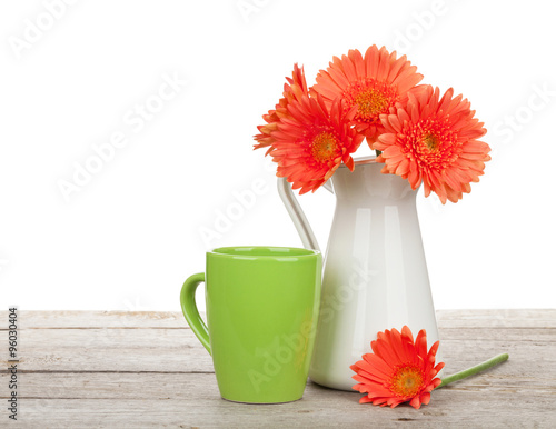Fototapeta Naklejka Na Ścianę i Meble -  Orange gerbera flowers in pitcher