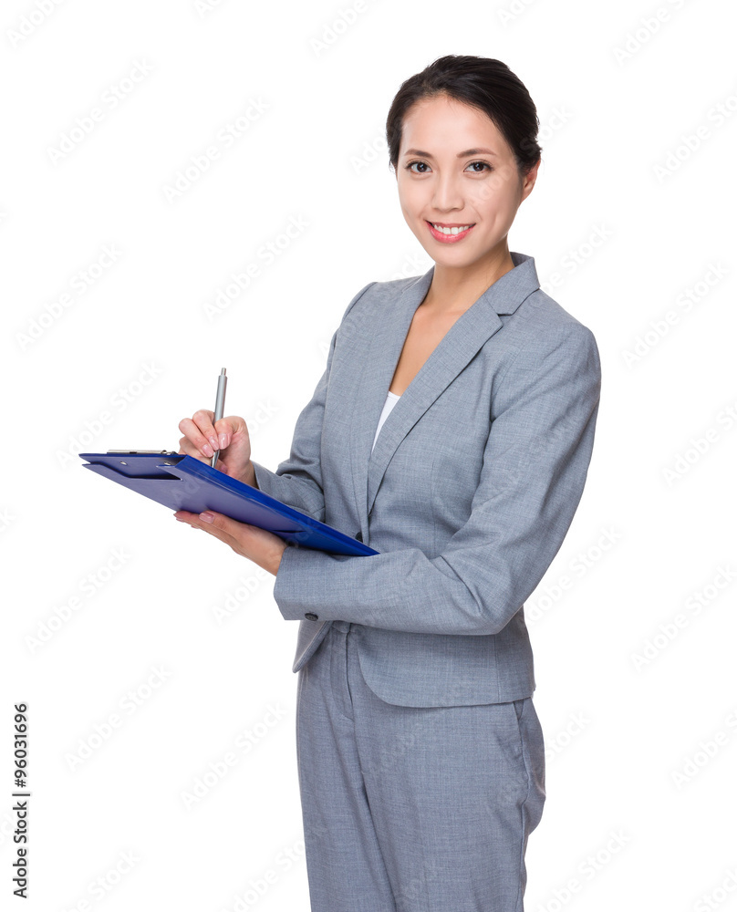 Young Businesswoman take note on clipboard Young Businesswoman take note on clipboard