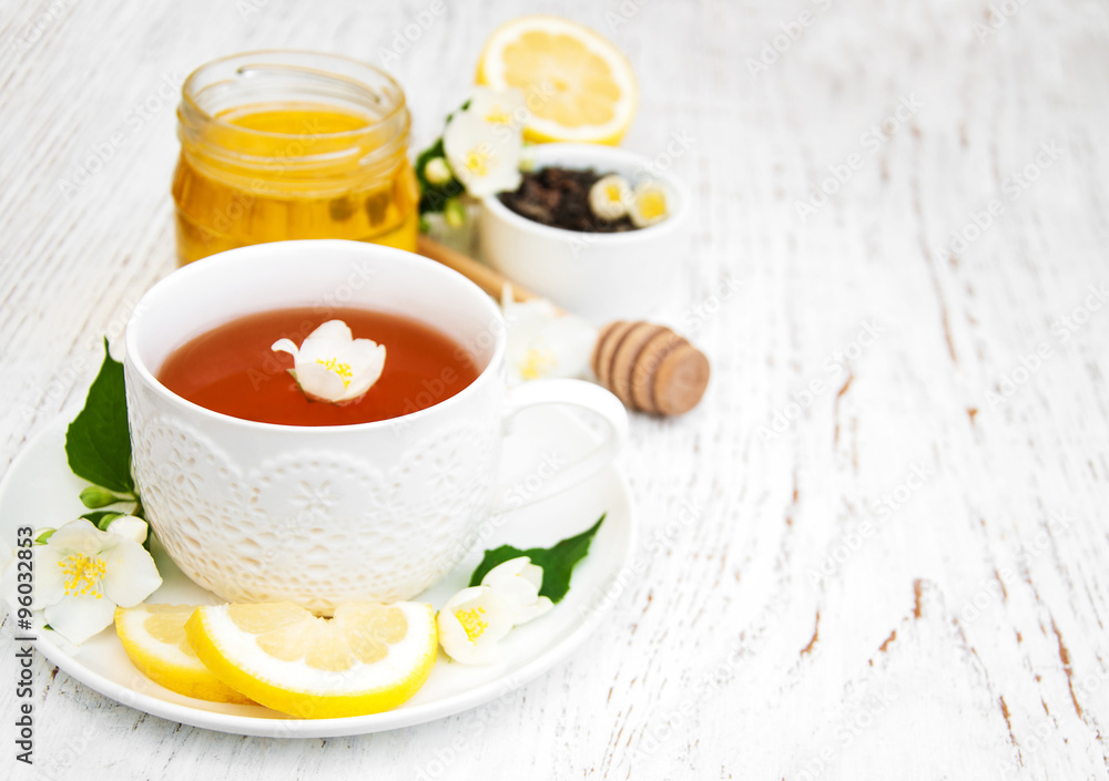 Cup of tea with jasmine flowers Cup of tea with jasmine flowers