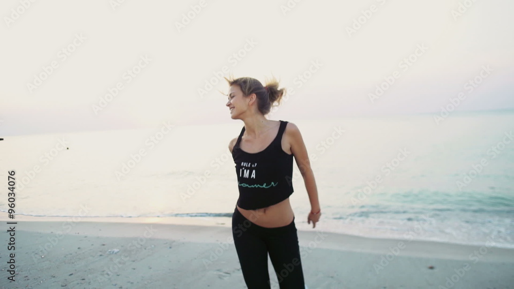 sportive joyful female jumps on the beach slow motion sportive joyful female jumps on the beach slow motion