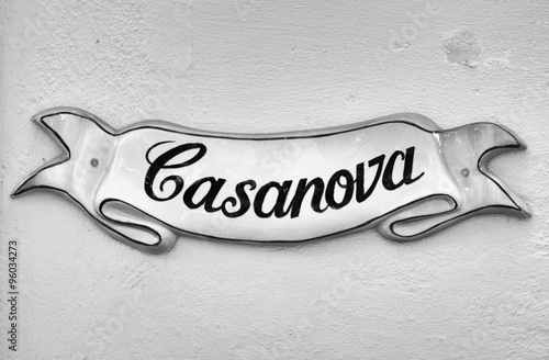 Street sign in Mdina,Malta, with the text “Casanova” (black and white tones).