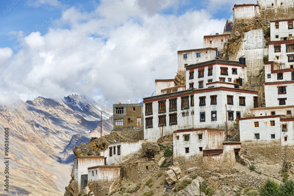 Tibetan style buildings located on edge of high rock