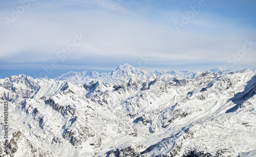 White Summit among snowy rock mountain range