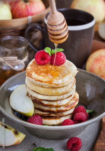 Breakfast with apple pancakes with honey