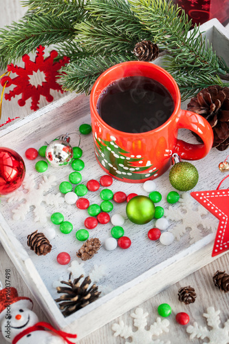 Christmas coffee cup and candies photo