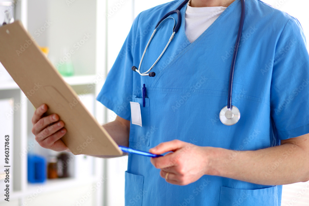 Closeup portrait of a doctor with stethoscope holding folder Closeup portrait of a doctor with stethoscope holding folder
