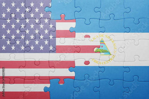 puzzle with the national flag of united states of america and  nicaragua