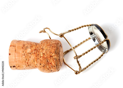 Champagne wine cork and muselet isolated on white background photo