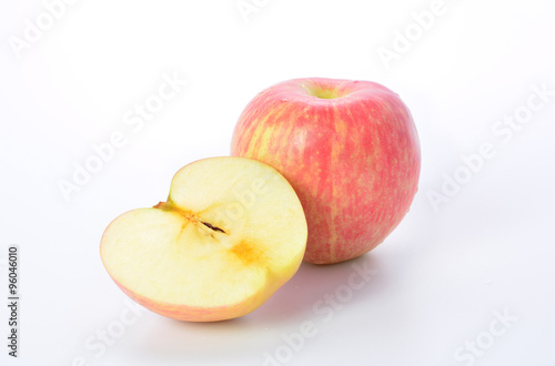 Red apple and slice on a white background