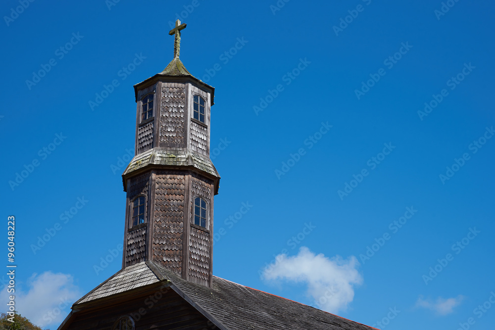 Tower of historic wooden church, Iglesia de Colo, built in the 17th century by Jesuit missionaries on the island of Chiloe in Chile. Tower of historic wooden church, Iglesia de Colo, built in the 17th century by Jesuit missionaries on the island of Chiloe in Chile.