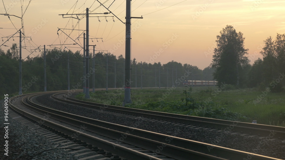 Train turning and passing by outside the town Train turning and passing by outside the town