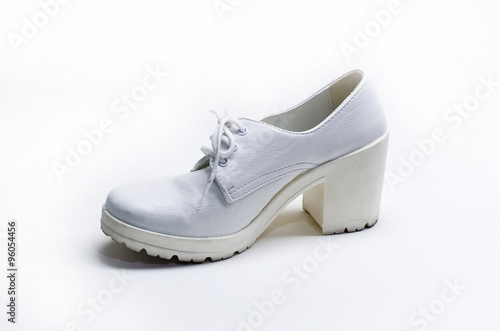 Used white leather woman shoe on white background
