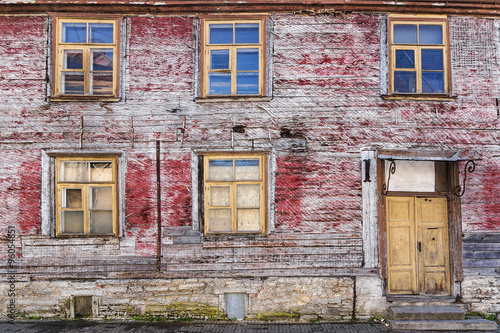 facade of an old abandoned wooden house © dimbar76