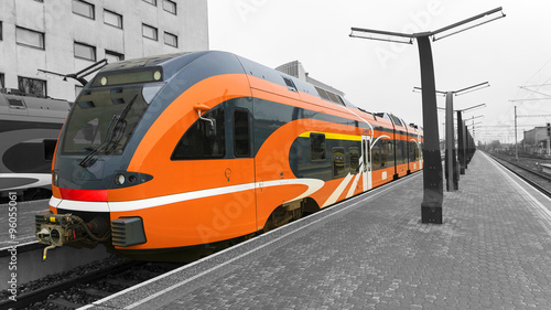 Orange high-speed train on the platform of the train station