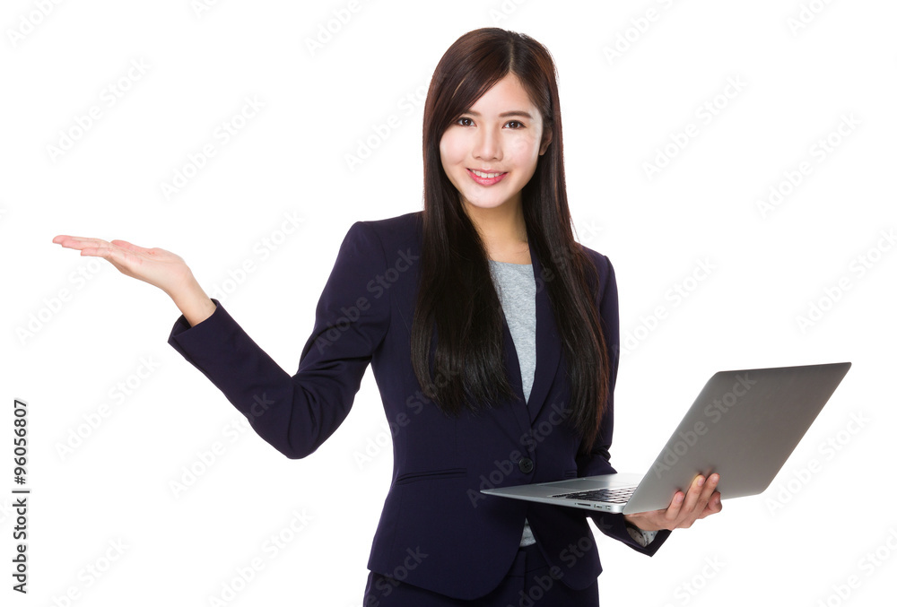 Young Businesswoman hold with laptop computer and open hand palm Young Businesswoman hold with laptop computer and open hand palm