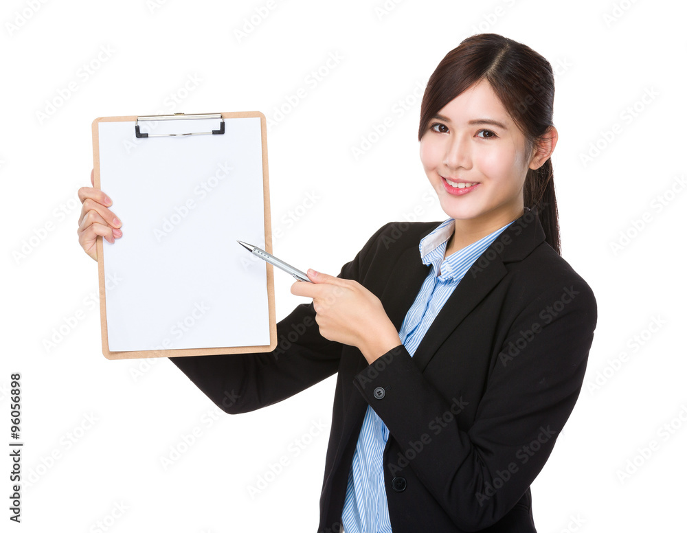 Asian Businesswoman with pen point to clipboard Asian Businesswoman with pen point to clipboard