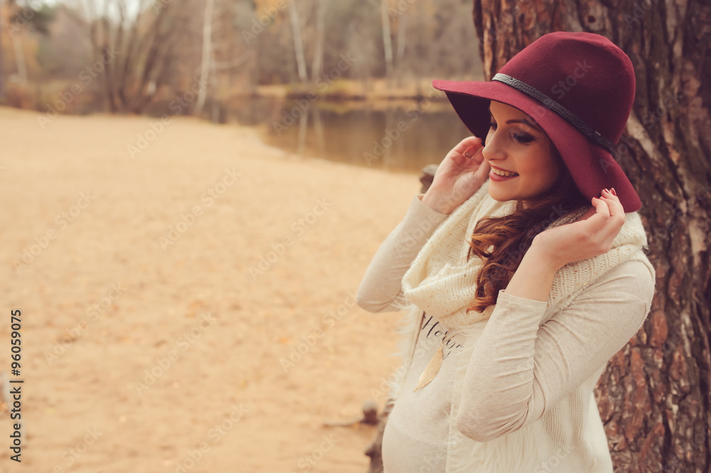 pregnant woman walking outdoor, cozy mood, soft toned