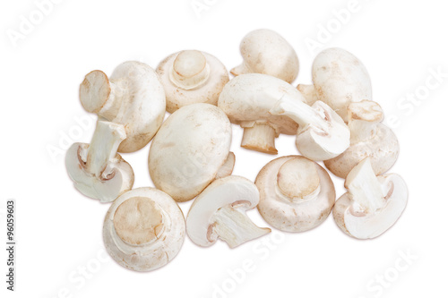 Pile of champignon mushroom on a light background
