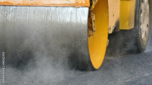 Road roller doing road repair and paving of streets, Slow Motion Video clip