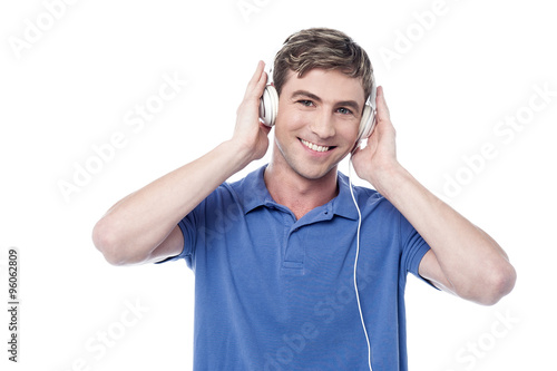 Young guy listening to music