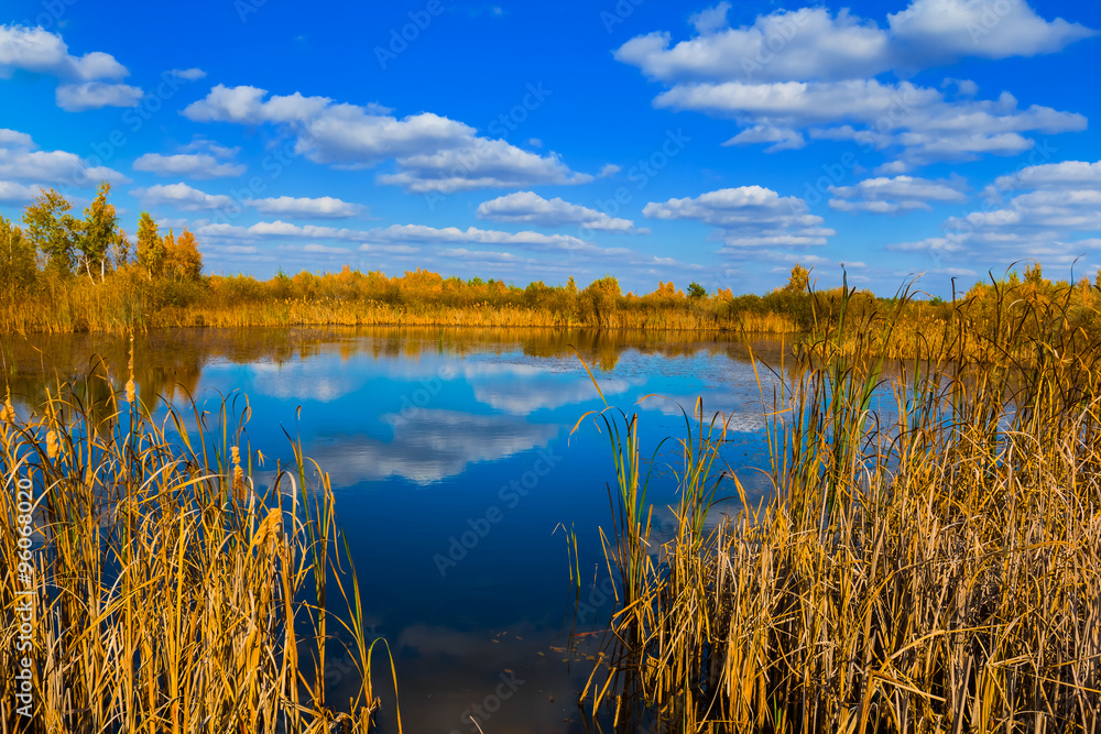 small blue lake among a prairies