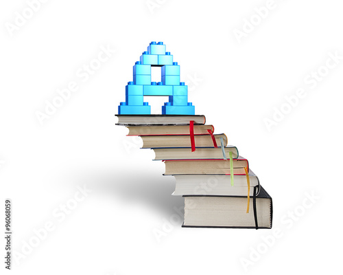 Alphabet letter A shape blocks on stack books stairs