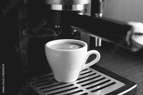 Preparing espresso in coffee machine