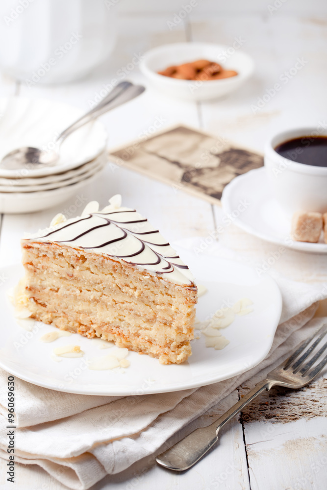 Traditional Hungarian Esterhazy cake with coffee cup and vintage postcards . Traditional Hungarian Esterhazy cake with coffee cup and vintage postcards .