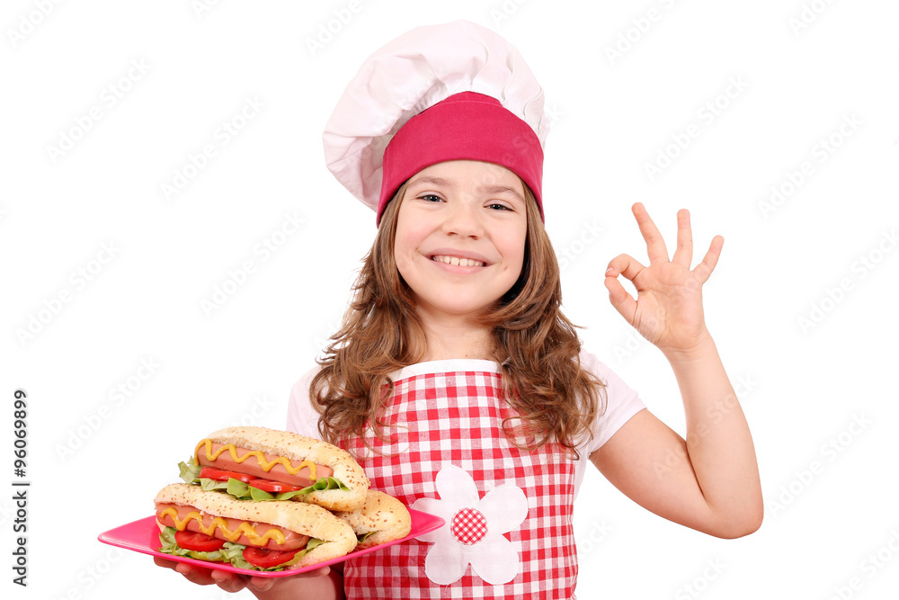 happy little girl cook with hot dogs and ok hand sign happy little girl cook with hot dogs and ok hand sign