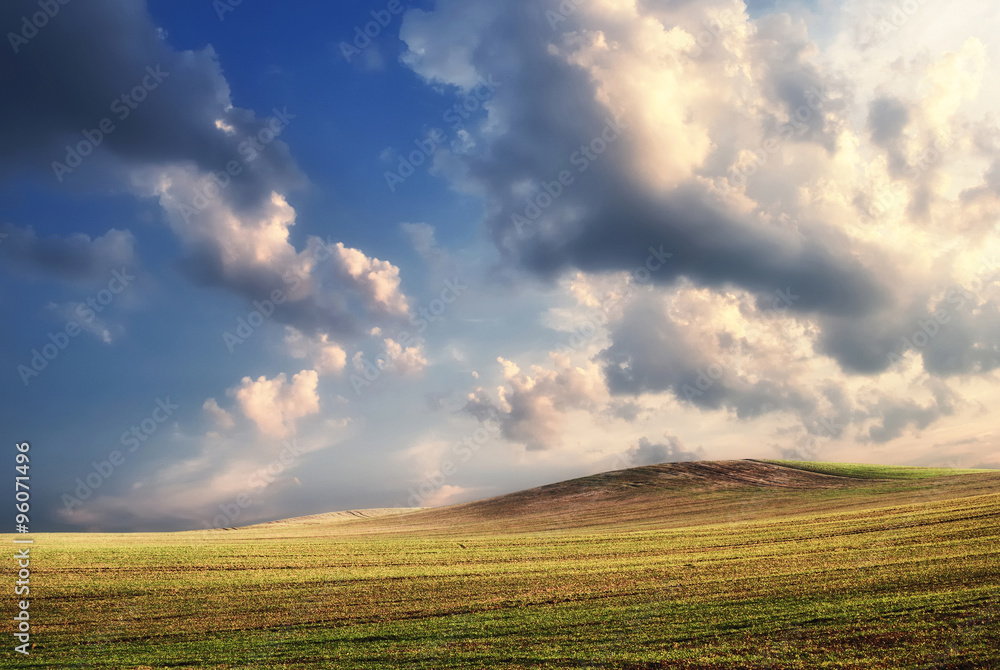 Farmland field with clouds before the sunset, Hungary Farmland field with clouds before the sunset, Hungary